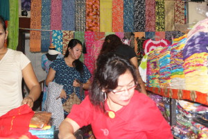 Our designer and owner Widura(pictured in the back) meeting with one of our suppliers and inspecting the inventory along with her mother(front).